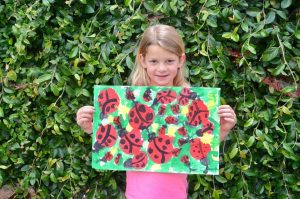 Girl with Lady Bug Painting